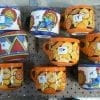 Bright mugs in orange and blues and reds