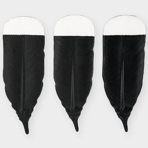 Three huia feathers made by Crown Lynn Kiwi